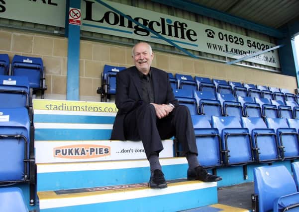 Stepping Forward: Matlock Town chairman Tom Wright pictured on the new advertising steps in The Twigg Stand at the Reynolds Stadium.