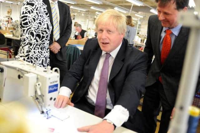 Boris Johnson on the Vote Leave campaign trail, with Alfreton clothes producer Christopher Neiper and Amber Valley MP Nigel Mills.