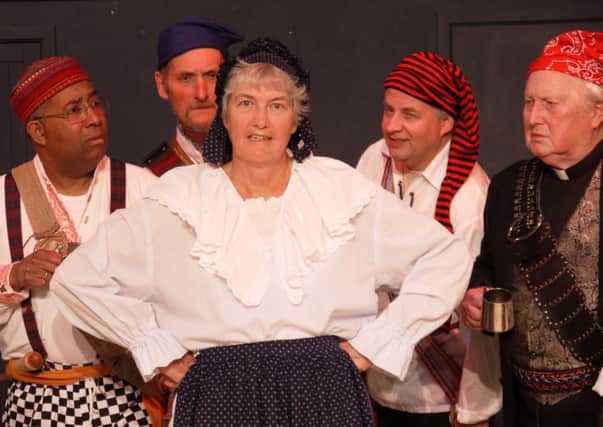 Ruth, played by Angela Robinson, shares her sad tale with the pirates in The Pirates of Penzance in Matlock G & S Society's production of The Pirates of Penzance.