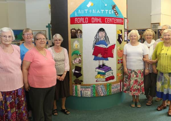 Wirksworth Library's knit and natter group who have knitted a wells dressing based on the works of Roald Dahl