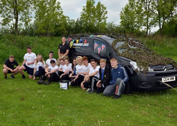 A group of students at Heanor Gate Science College took part in a van pull for charity after training with Commando Joe's