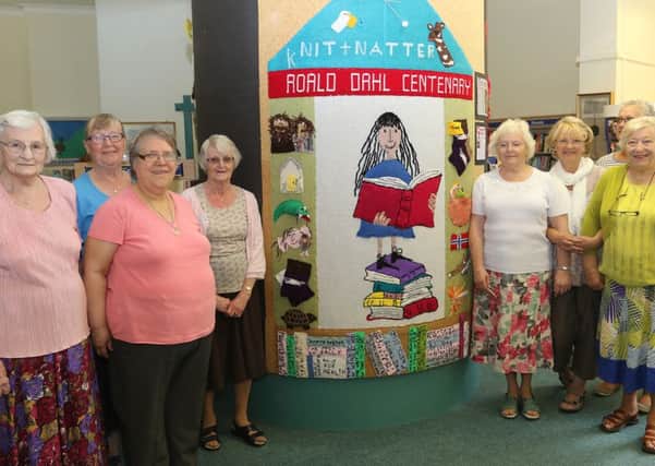 Wirksworth Library's knit and natter group who have knitted a wells dressing based on the works of Roald Dahl