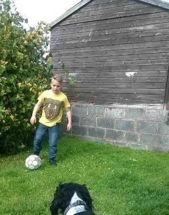 Joe Boyer, 14, playing football in his garden before hit by motorbike in Staveley.
