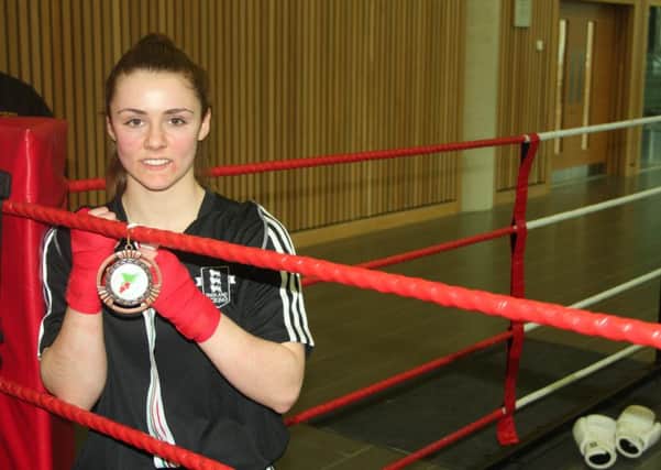 PACKING A PUNCH -- medal-happy teenager Jade Ashmore, who continues to make her mark as a boxer.