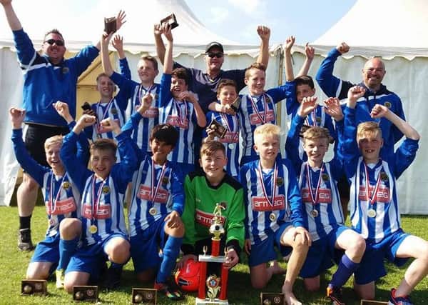 SEASIDE SIZZLERS -- the Staveley Miners Welfare U12s team that won the prestigious, annual Blackpool Youth Football Tournament.