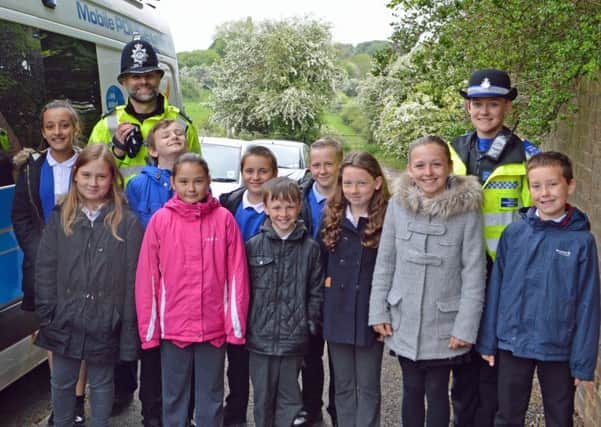 Stonebroom Primary School youngsters with PC David Price and PCSO Hannah Disney.