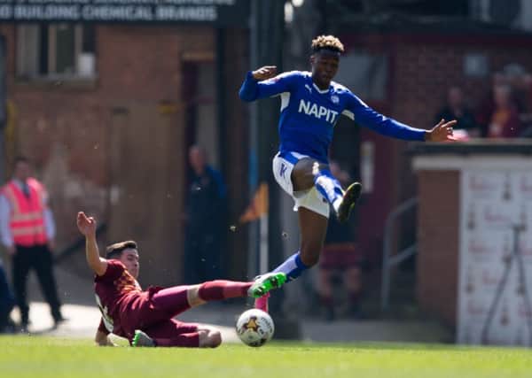 Bradford City vs Chesterfield - Gboly Ariyibi leaps a challenge from Josh Cullen - Pic By James Williamson