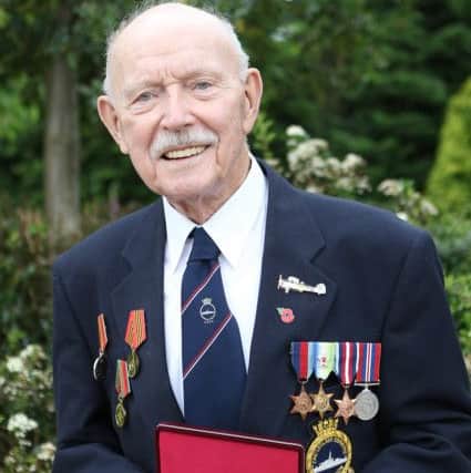 Albert Wilson with his latest Russian medal issued to mark his service on arctic convoys during WW2