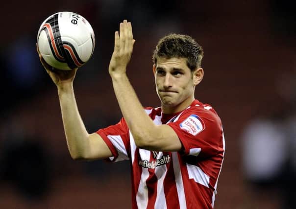 Ched Evans with the matchball after scoring a hat-trick against Chesterfield