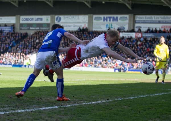 Chesterfield vs Sheffield United - Connor Dimaio sends Jay McEveley flying - Pic By James Williamson