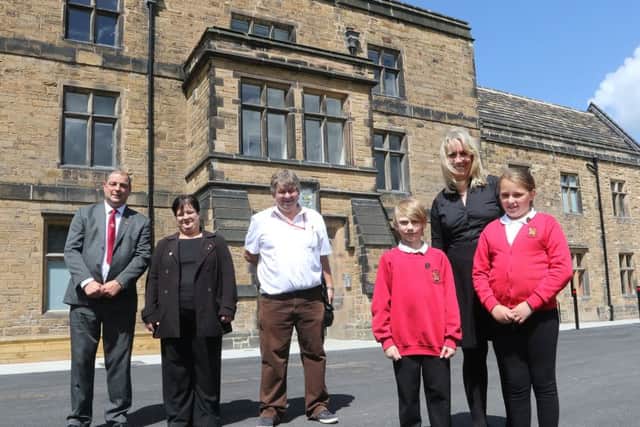 Staveley Hall, councilors Barry Dyke, Lisa-Marie Derbyshire and Anthony Hill with Annalise Harvey and Wyatt Sharman head girl and boy from Poolsbrook School and Andrea Hughes head teacher