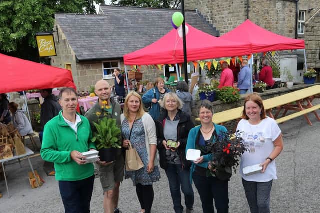 Some of the directors of the Anglers Rest Community Pub at the farmers market which started their fun day of free events