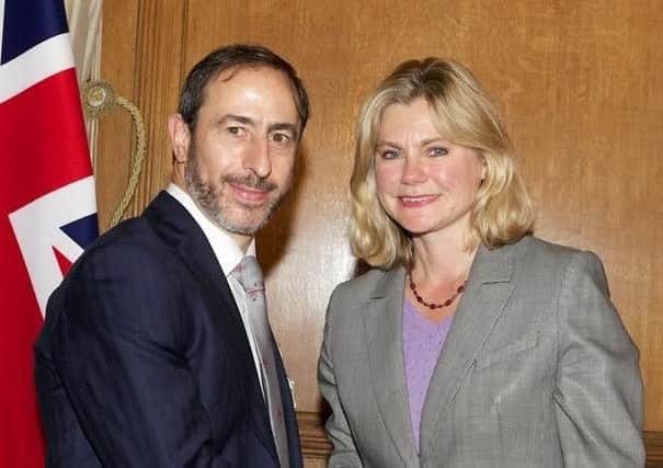 Sam Allen with minister Christine Greening last year when he received the special Ebola medal.