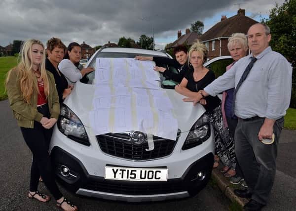 Samantha Adams is protesting as her mobility car is about to taken away, Samantha is pictured with family and friends
