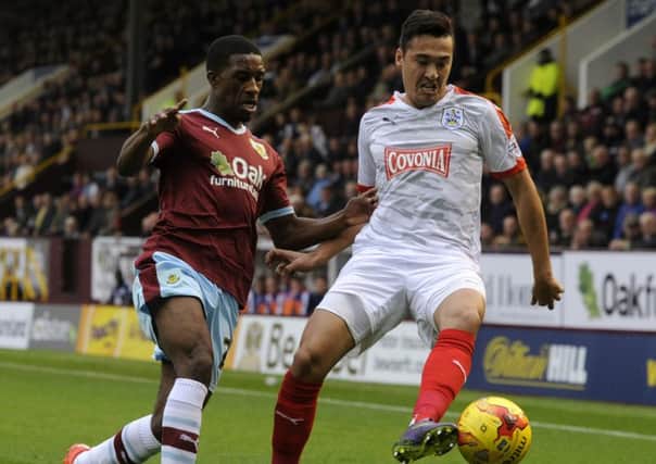 Tendayi Darikwa and Jason Davidson challenge for the ball.
Burnley FC V Huddersfield Town.  Turf Moor.,  SkyBet Championship.  31 October 2015.  Picture Bruce Rollinson