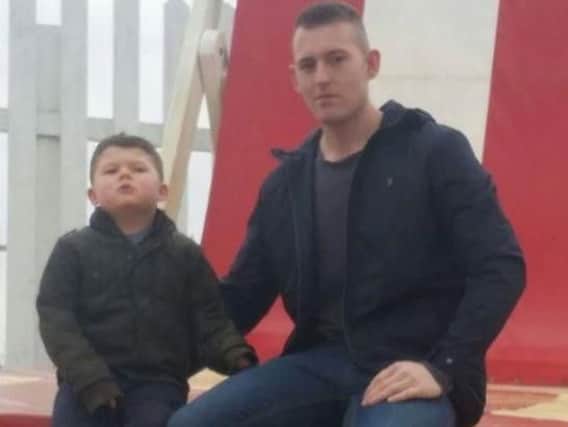 Chris Henchliffe with his son. Picture released by family.