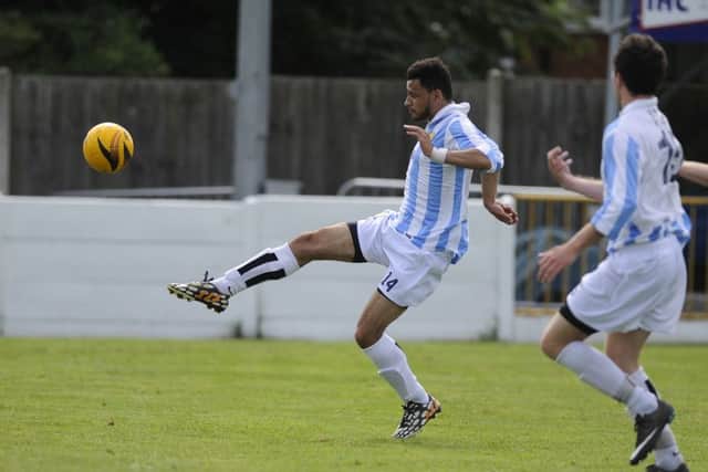 FC Bolsover's Josh Thomas pictured lifting the ball over the keeper in Saturday's pre-season friendly at Pinxton.