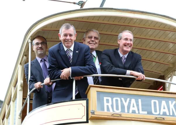 Dr Mike Galer and Dave Frodsham of Crich Tramway with Bob Mason director of Blackpool Trams and Bryan Lindop head of heritage celebrate the restoration of the balcony tram no.40
