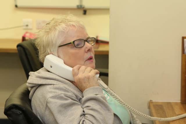 Chesterfield Samaritans volunteer Bernadette in the operations room where calls and emails are received