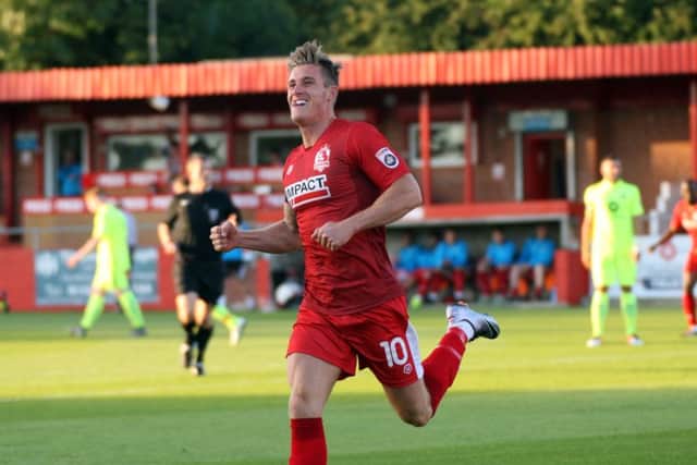 Dan Bradley races away to celebrate Alfretons second goal.