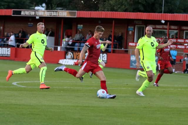 Dan Bradley races clear of the Gainsborough defence to lash home Alfretons third goal.