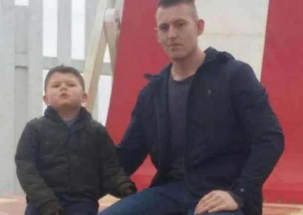 Chris Henchliffe with his son. Picture released by family.