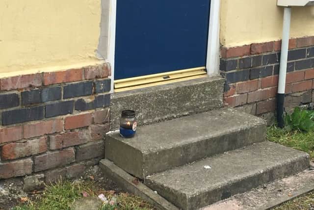 A candle was left on the doorstep of a house on Campbell Drive.