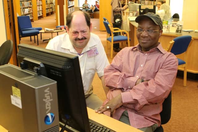 Chesterfield Library, Patrick Scott assists Adekunle Lawal