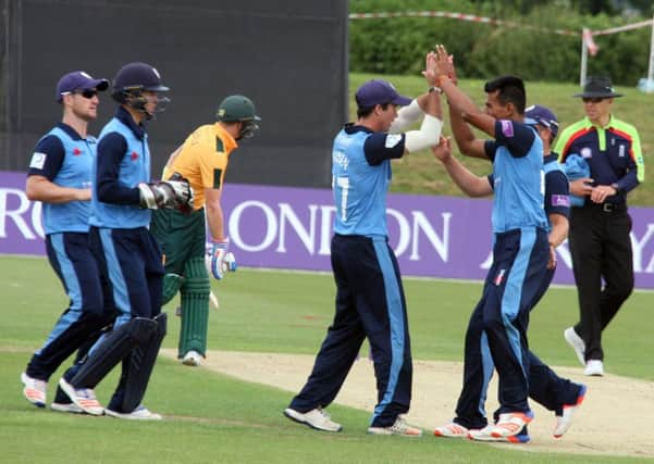 Derby Falcons Wayne Madsen and Shiv Thakor celebrate the fall of the wicket of Michael Lumb.
