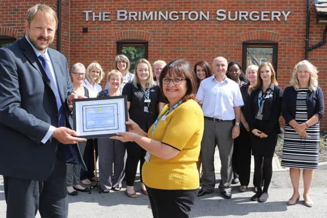 MP Toby Perkins helped staff at Brimington Surgery celebrate achieving the Derbyshire Dignity Award.