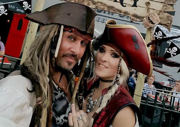 Captain Jack Sparrow look-a-like Wayne Truman proposed to girlfriend Sarah Page at the pirate-themed event.