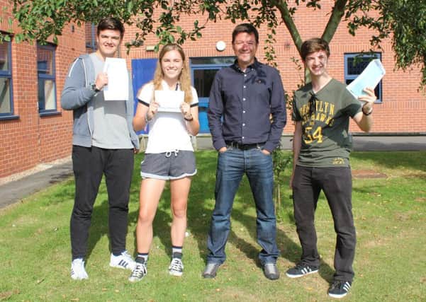 Friesland students Tim Wakefield, Nicole Allen and Blake Smith-Tyler with sixth form director Matt Puddy (second from right).