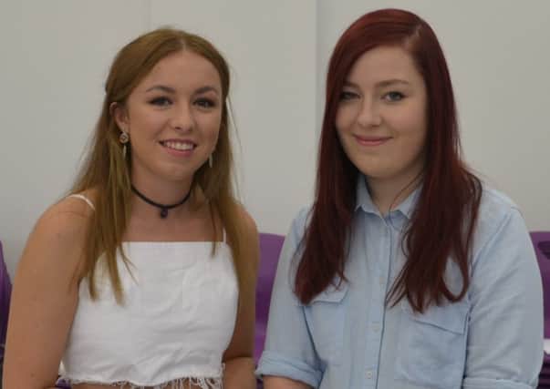 Ormiston Ilkeston Enterprise Academy students Holli Patrick (left) and Laura Kibble (right) collect their A-level results.