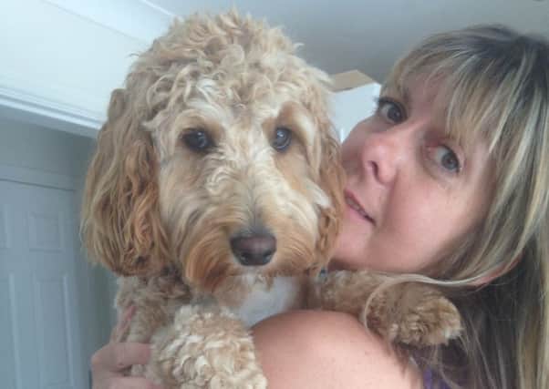 GOING FOR GOLD -- Andrea Wass, pictured with her puppy and training partner, Archie, is to tackle the Great North Run to mark her 50th birthday.