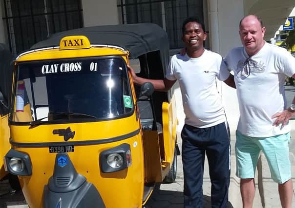 Peter Hanratty with Clay Cross taxis in Madagascar.