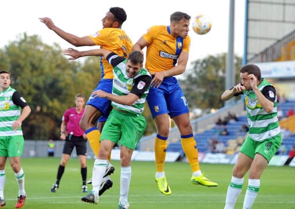 Mansfield Town v Yeovil Town.
Kyle Howkins and Rhys Bennett compete for the same corner ball during the first half.