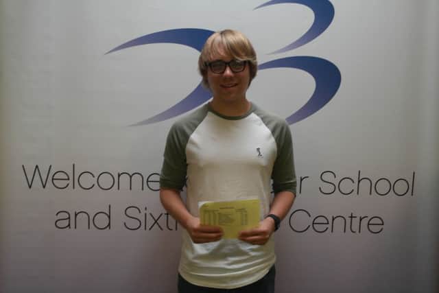 Eliot Cholerton-Hill collects his GCSE results at Belper School.