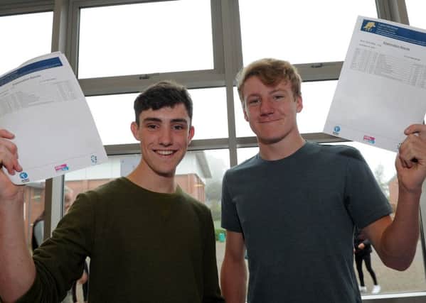 Tupton Hall School students Ashley Cullum and Oliver Wilby with their GCSE results. Picture: Andrew Roe