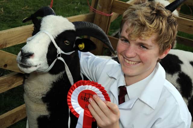 Nathan Fozzard with his first-placed Jacob sheep.