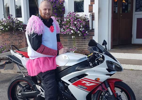 DRESSED FOR THE OCCASION -- Andy Bridgewater, in fancy dress and on his bike, ready for the 500-mile marathon.