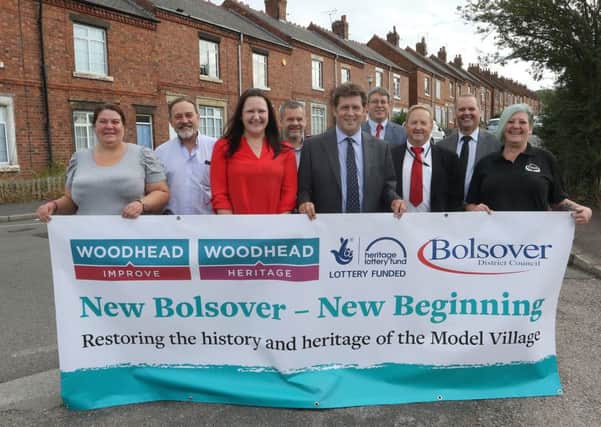 New Bolsover, residents and members of the friends group celebrate with other key stake holders after the announcement that Woodhead have been appointed manage the restoration of the area.