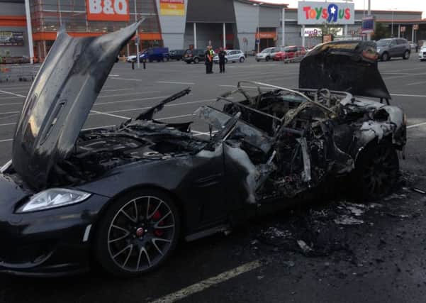 A fire which destroyed a luxury sportscar outside a Chesterfield DIY store is being treated as arson.