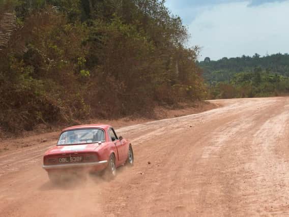 Allison and Peter Coates with their 1967 Lotus Elan driving through the Brazilian rainforest on the Great Amazon Adventure. Picture: Rod Kirkpatrick.