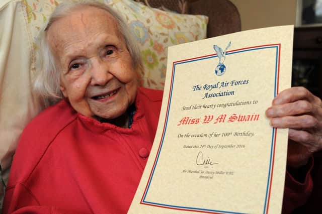Winnie Swain with her certificate from the Royal Air Forces Association congratulating her on her 100th birthday.