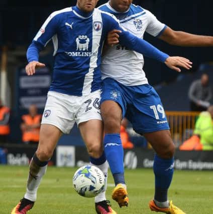 James O'Shea battles with Bury's Jacob Mellis. Pic by Andrew Roe.
