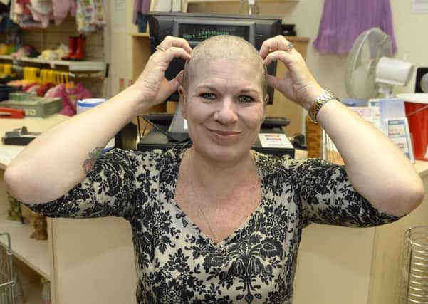 Dawn Straw has her hair shaved off at the Lighthouse Shop in Alfreton to raise money

Picture: Sarah Washbourn