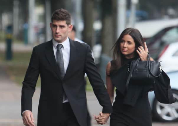 Footballer Ched Evans with partner Natasha Massey,  arriving at Cardiff Crown Court to go on trial accused of raping a woman in May 2011. PRESS ASSOCIATION Photo. Picture date: Tuesday October 4, 2016. The 27-year-old entered a not guilty plea during a court hearing in May. See PA story COURTS Evans. Photo credit should read: Steve Parsons/PA Wire