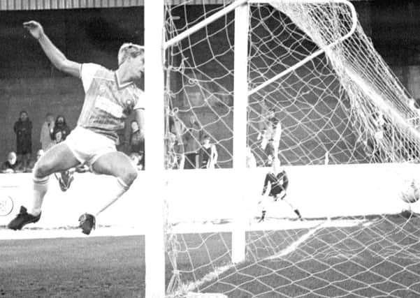 Club photographer Alan Roe illustrated the benefits of proper preparation by being on the spot to capture the balletic desperation of a Chester defender as Steve Kendals speculative first minute shot evaded him and looped into the net to open the scoring