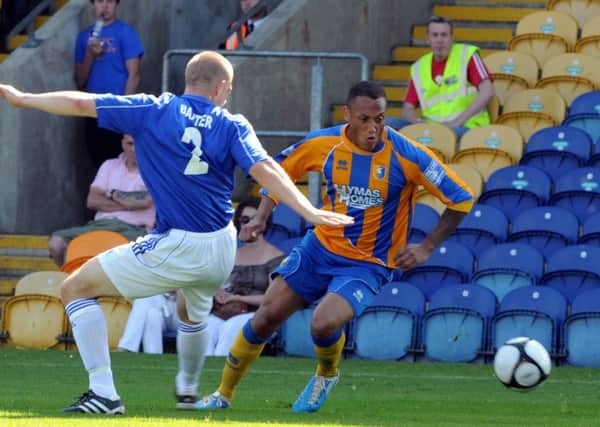 Adam Smith in action for Mansfield Town.