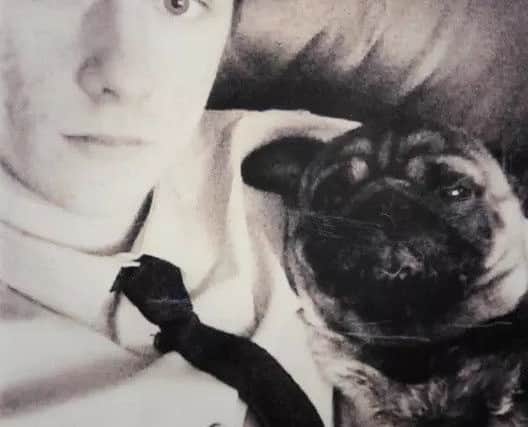 Adam Elliott with his pet pug Finley. Picture submitted.